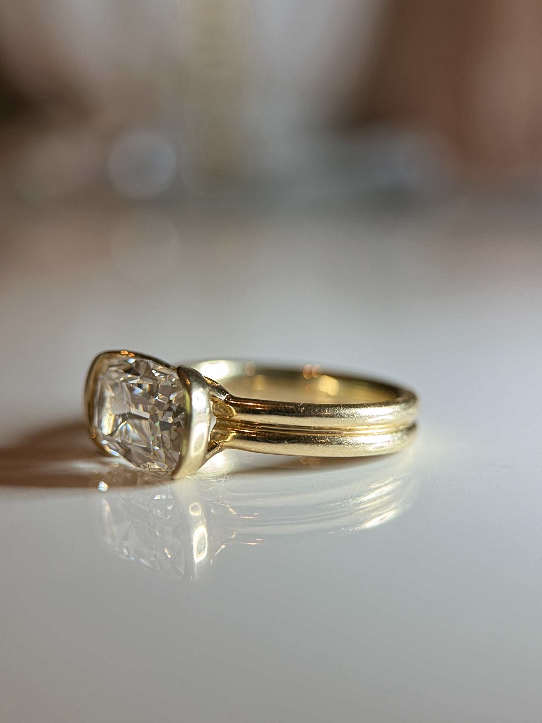 E/W Elongated Antique Cushion - half bezel double band